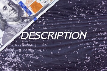 DESCRIPTION - word (text) on a dark wooden background, money, dollars and snow. Business concept (copy space).