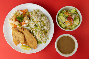 Meal - Fish fillet, rice with broccoli, beans, vegetables in butter and salad