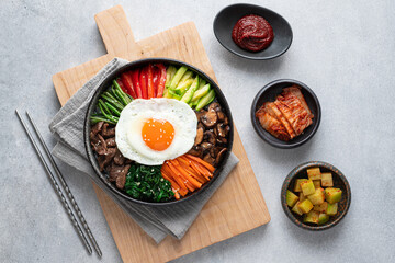  Bibimbap on a concrete background, traditional korean dish, top view