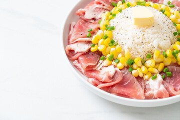 fresh pork raw sliced with rice and corn on plate and ready to cook