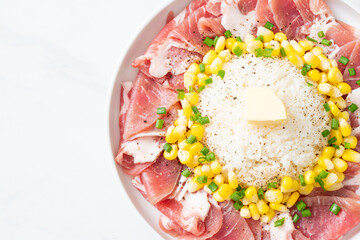 fresh pork raw sliced with rice and corn on plate and ready to cook