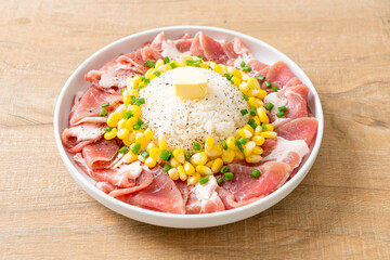 fresh pork raw sliced with rice and corn on plate and ready to cook