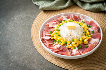 fresh pork raw sliced with rice and corn on plate and ready to cook