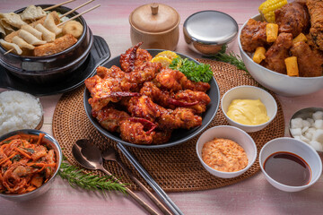 Gang Jeong chicken or crispy and tender Korean fried chicken smothered in a sticky, spicy red sauce Served with kimchi, dipping sauce, rice and sweet corn.