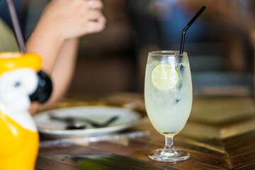 iced lemon soda glass in cafe