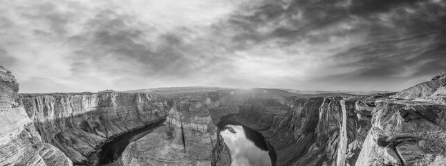 Horseshoe Bend panoramic aerial view, Arizona. Rocks and Colorado River at sunset in black and...
