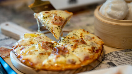 Fresh Homemade Italian Pizza Margherita, Slice of hot pizza large cheese breakfast, lunch ,dinner crust seafood meat topping sauce. fast food italian traditional on wooden board table