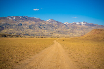 Fototapeta na wymiar Road in Kyzyl-Chin valley or Mars valley with mountain background in Altai, Siberia, Russia.
