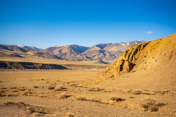 Fototapeta na wymiar Kyzyl-Chin valley or Mars valley with mountain background in Altai, Siberia, Russia.