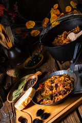 Polish bigos cooked according to an old recipe with wine and plum