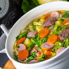 delicious savoy cabbage soup in white vase