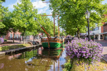 Wooden sailing ship in the shopping street of Papenburg, Germany