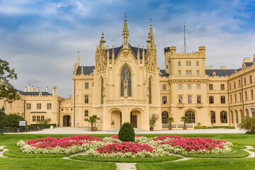 Fototapeta na wymiar Flowers and front facade of the castle in Lednice, Czech Republic