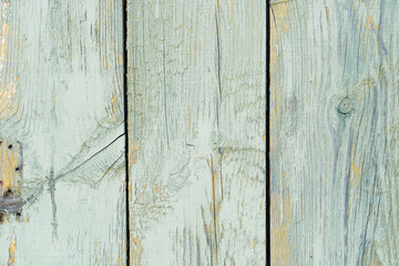 Fototapeta na wymiar Wooden natural background, old paint on wooden fence surface. Vintage retro cracked wooden planks