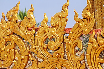 Traditional Thai style golden stucco in Thai temple