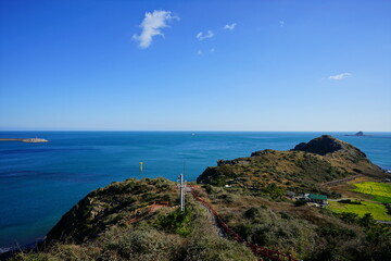 fine seascape with lighthouse and island