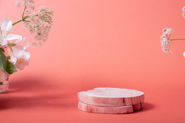 Natural minimal beauty wooden pedestal. Empty cosmetics podiums on pink background with flowers for...