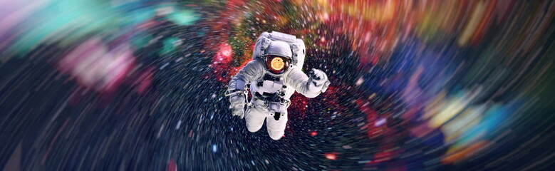 Picture of astronaut spacewalking with glowing stars . Astronaut in outer space. Elements of this image furnished by NASA. - obrazy, fototapety, plakaty