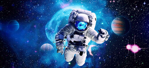 Astronaut in space in the solar system Earth. Blue light on background. Elements of this image furnished by NASA - obrazy, fototapety, plakaty