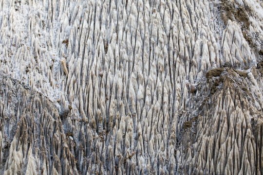 Close-up of salt rocks outside the Praid salt mine. Icicle or spearhead shape.