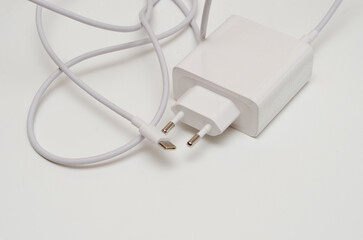 white laptop charger with type-c cable