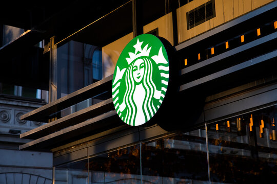 Belgrade, Serbia - November 15, 2021: Starbucks logo at the store front in Belgrade, Serbia. Starbucks Corporation is an American multinational chain of coffeehouses 
