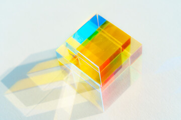Early-colored square prism on a white background
