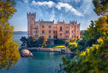 Fototapeta premium Spectacular summer view of Miramare Castle. Wonderful morning seascape of Adriatic sea. Exciting outdoor scene of Italy, Europe. Traveling concept background.