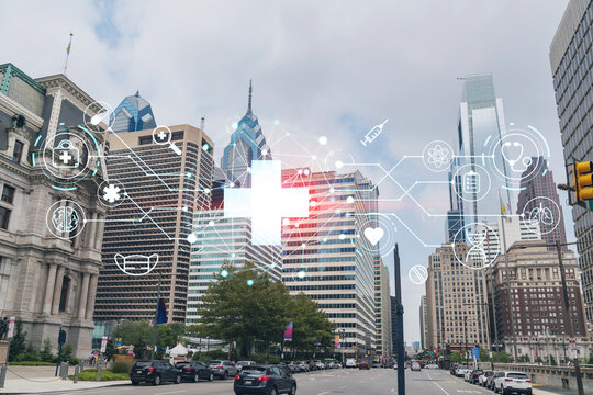 Day time cityscape of Philadelphia financial downtown, Pennsylvania, USA. City Hall neighborhood. Hologram healthcare digital medicine icons. The concept of treatment from disease, Threat of pandemic