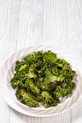 white plate with kale chips on the table