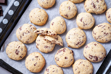 Chocolate chip cookies on baking tray at domestic kitchen
