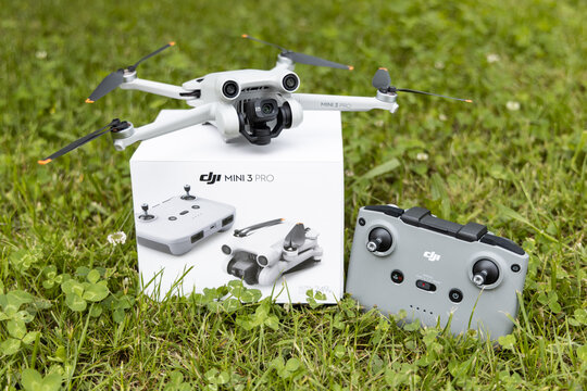DJI Mini 3 Pro drone with original packaging and controller on a meadow, June 09, 2022, Germany	