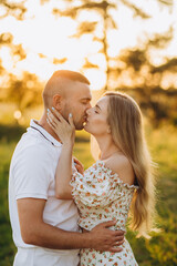 beautiful shot of kissing couple in the sunlight