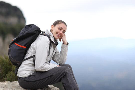 Happy trekker looking at camera in the mountain