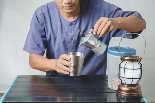 Asian Boy Learning To Make Coffee With Moka Pot.