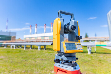 Industry control level and inspection chimneys power plant roof Laser optical theodolite on tripod....