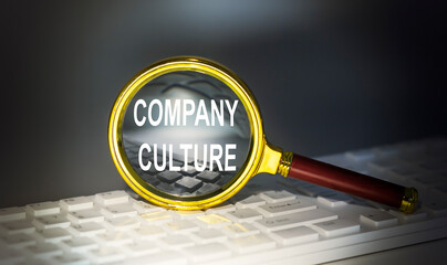 COMPANY CULTURE word concept on a magnifier on the keyboard