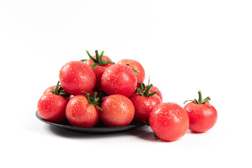 cherry tomatoes in plate isolated on white background.