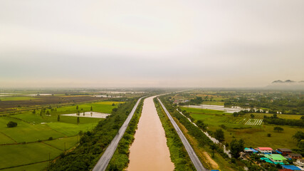 Photograph of beautiful countryside green tree forrest landscape. Mountain hill as blue background. Aerial photograph. View of the countryside at sunrise