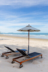 Beach chairs under ambrella on holiday - obrazy, fototapety, plakaty