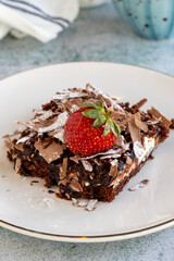 Chocolate cake. Cake with chocolate chips and chocolate sauce. close up