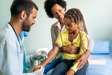 Doctor taking blood test from child patient. Healthcare, examination, kid concept.