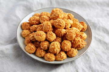 Homemade Crumbly Biscuits with Parmigiano Reggiano on a Plate, side view.