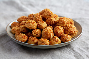 Homemade Crumbly Biscuits with Parmigiano Reggiano on a Plate, side view.
