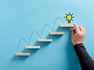 Ladder of success, brainstorming, reaching to an idea or idea generation concept. © Cagkan