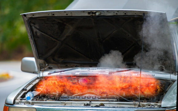 Short circuit suspected as cause of car engine fire.