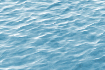 Light blue water surface background. Full frame photography.