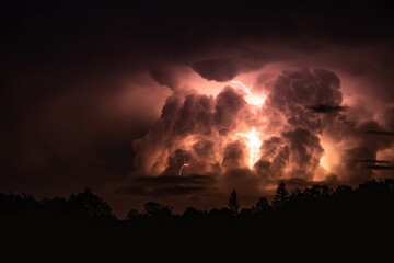 Lightning in the sky during a storm at night