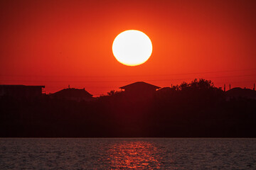 The sun goes down over a lake
