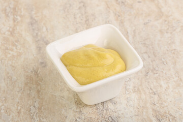 Organic mustard sauce in the bowl